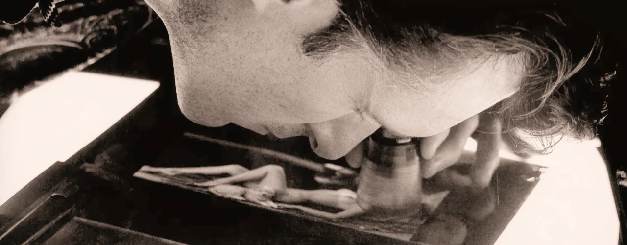 Hugh Hefner examining film negatives