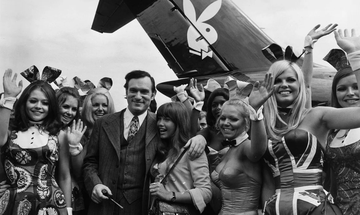 Hugh Hefner reviewing Playboy editorial material